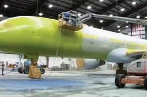 Jet is stripped, primed and repainted - Chennault Air Cargo Facility