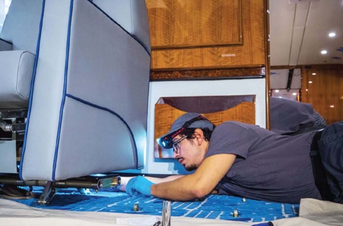 Citadel Completions technician installs luxury aircraft seating at Chennault International Airport